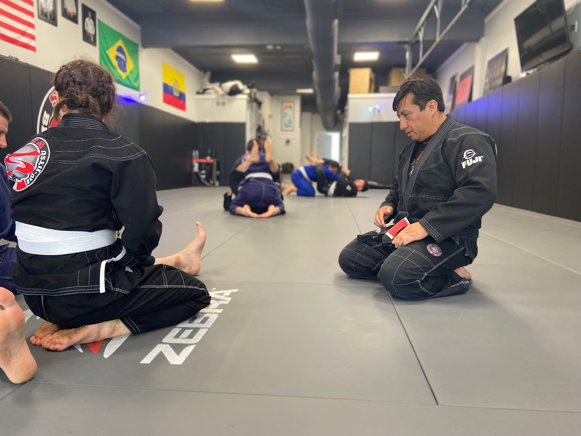 Professor Cristian Buitron — Mat-side while the class rolls
