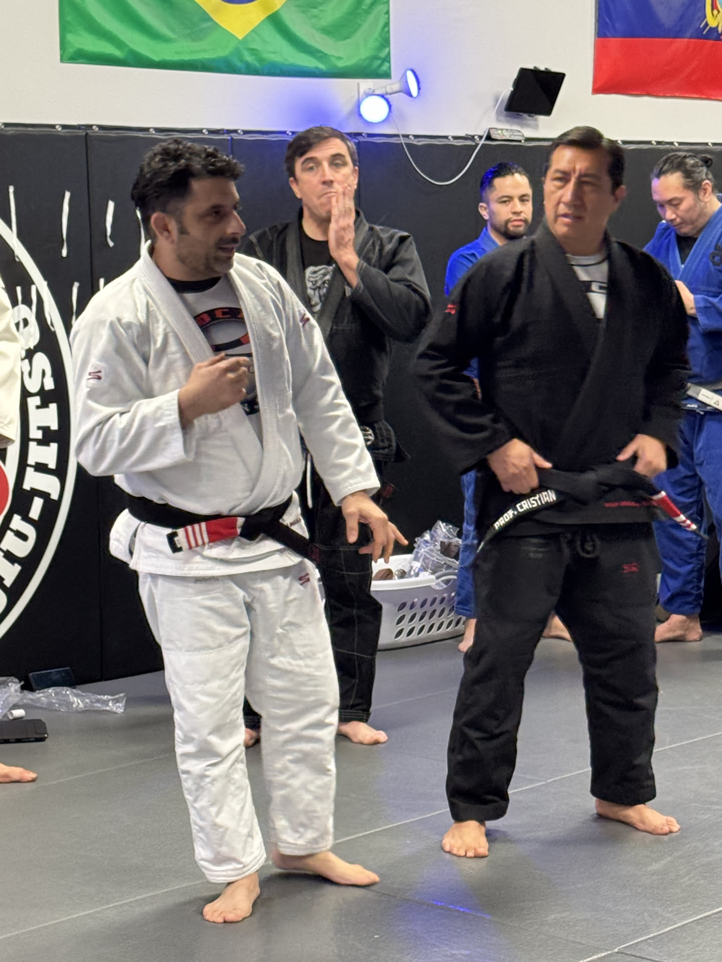 Professor Cristian Buitron — Tying on the black belt