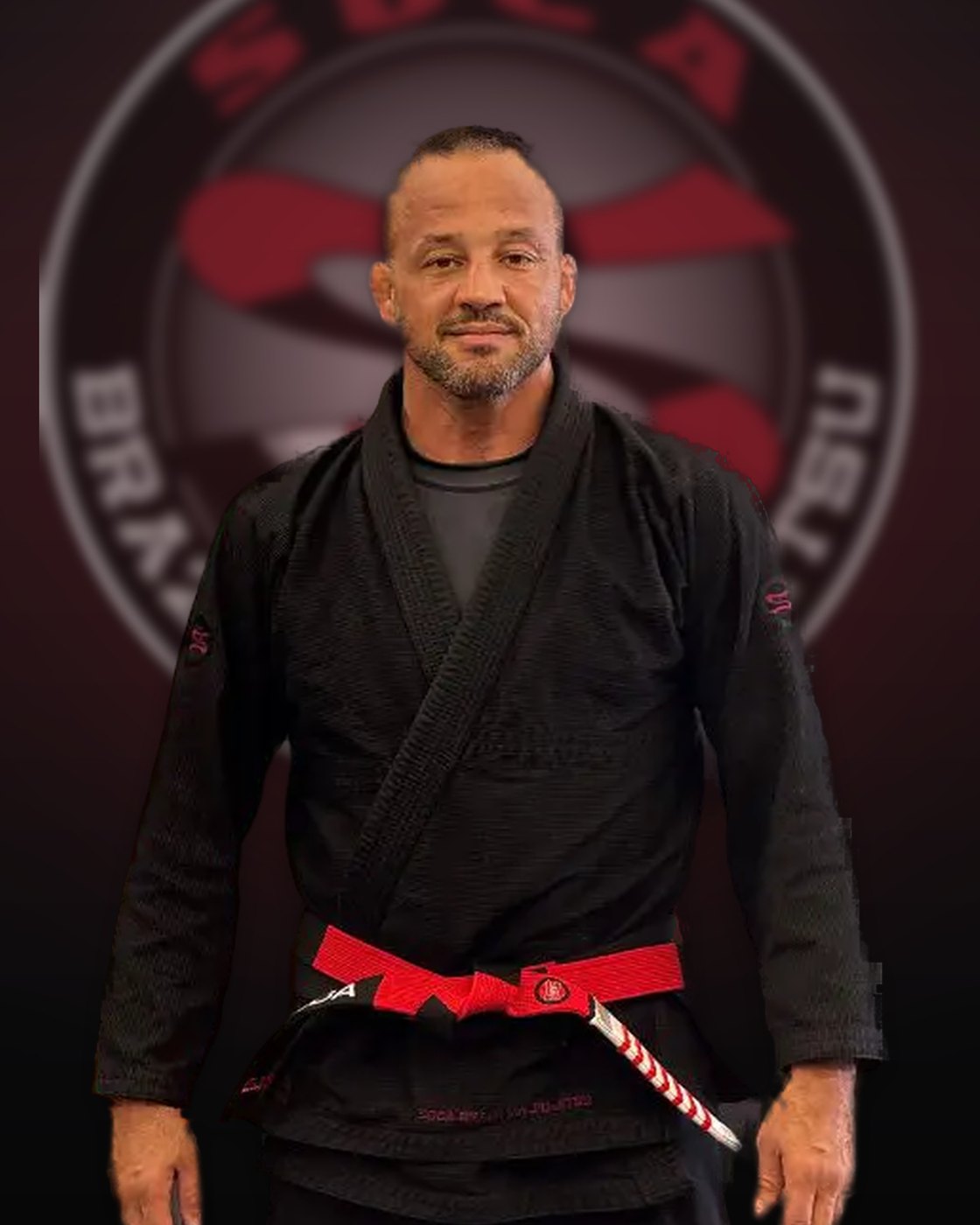 Professor Alexandre Soca Freitas — coral belt founder of Soca BJJ